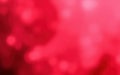 Bright red background with soft light effect creating a vibrant and abstract atmosphere during a creative event