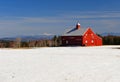 Bright red barn and snow covered field Royalty Free Stock Photo