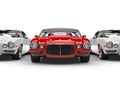 Bright red beautiful vintage American car - stands out of the line of white cars Royalty Free Stock Photo