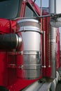 Bright red big rig semi truck close-up view of chrome details an Royalty Free Stock Photo