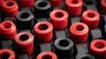 Bright Red and Black Rubber Components Arranged in a Geometric Pattern on a Textured Surface Royalty Free Stock Photo