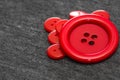 Bright red buttons. Gray fabric. Blurred background. The concept of the clothing industry and decor Royalty Free Stock Photo