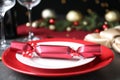 Bright red Christmas cracker on table, closeup Royalty Free Stock Photo