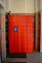 a bright red delivery locker in a grocery store