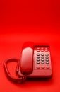 Bright red desktop telephone Royalty Free Stock Photo