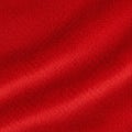 Bright red fabric texture with visible diagonal ribbing. The material appears soft with Royalty Free Stock Photo