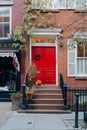 Bright red front door on a house in West Village, Manhattan, New York, USA Royalty Free Stock Photo