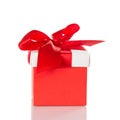 Bright red gift box with bow isolated on white Royalty Free Stock Photo