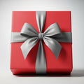 Bright Red Gift Box With A Silver Satin Bow On A White Background present Royalty Free Stock Photo