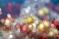 Bright red and gold balls on blurred sparkling background, bokeh lights. Golden new year 2021. Merry Christmas card Royalty Free Stock Photo