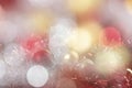 Bright red and gold balls on blurred sparkling background, bokeh lights. Golden new year 2021. Merry Christmas card Royalty Free Stock Photo