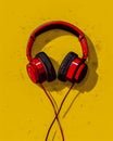 Bright Red Headphones Hanging on a Vibrant Yellow Background with Minimalistic Design and Shadow Play