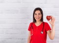 A bright red heart in the hands of a cardiologist doctor Royalty Free Stock Photo