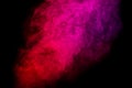 Bright red and pink smoke isolated on black background