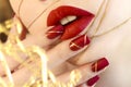 Bright red manicure with a design on nails