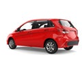 Bright red modern compact car - side view Royalty Free Stock Photo