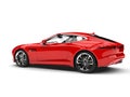 Bright red modern luxury sports car - side view - rear side Royalty Free Stock Photo