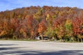 Bright red and orange foliage along hiking trail at Devil\'s Glen Royalty Free Stock Photo