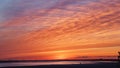 Bright red and orange sunset sky over the empty sea coast Royalty Free Stock Photo