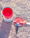 Bright red paint in can and brush Royalty Free Stock Photo