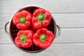 Bright red peppers in stainless steel colander