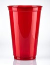 Bright Red Plastic Cup Isolated Against White Background Reflective Surface Royalty Free Stock Photo
