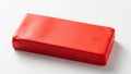Bright red rectangular block of material on a white surface Royalty Free Stock Photo