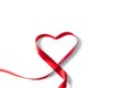 Heart shaped red ribbon for Valentine`s day celebration on an isolated white background Royalty Free Stock Photo