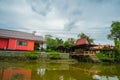 A bright red roof house Royalty Free Stock Photo