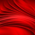 Bright red satin folds of the fabric.