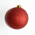 Red shiny ball on Christmas tree. Decorations on the Christmas tree. Christmas. New year. Red ball on white background. Royalty Free Stock Photo