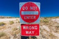 Bright Red sign warns drivers not to enter this lane of highway, Interstate 15, in desert outside of Las Vegas - WARNING - WRONG W Royalty Free Stock Photo