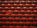 Bright red stadium seats on the stand Royalty Free Stock Photo