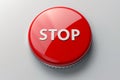 Bright red stop button with bold text isolated on a clean white background for urgent situations. Royalty Free Stock Photo