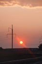 Bright red sunset over the track. Road to the city Royalty Free Stock Photo