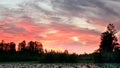 Bright red sunset sky at okeefenokee swamp Royalty Free Stock Photo