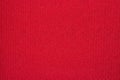 Bright red texture of dense fabric. Royalty Free Stock Photo