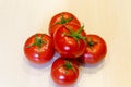 Bright red tomatoes with green leaves. Royalty Free Stock Photo