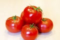 Bright red tomatoes with green leaves. Royalty Free Stock Photo