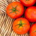 Bright red tomatoes with green ponytails. Royalty Free Stock Photo