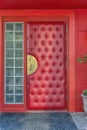 Bright red upholstered door at the entrance of a restaurant in Austin Texas