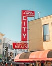 Bright red vintage Little City Market sign, in North Beach, San Francisco, California