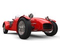 Bright red vintage open wheel sport racing car - low angle closeup shot