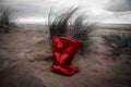 Bright Red Wellies On A Sandy Beach Royalty Free Stock Photo