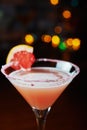 Bright refreshing cocktails on a table in a restaurant with creative decoration of red orange slices on a wooden table in a bar or Royalty Free Stock Photo