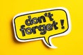 Bright reminder note emphasizing retention against vibrant yellow backdrop Royalty Free Stock Photo