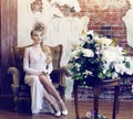 Bright retro bride in luxury interiors with elegant hairstyle an