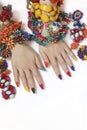 Bright rich multi-colored manicure on long nails with various types of jewelry