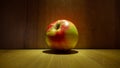 Bright ripe apple on a background of a wooden wall close-up. Royalty Free Stock Photo