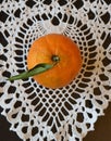 Bright Orange Tangerine, White Lace, Black Background Royalty Free Stock Photo